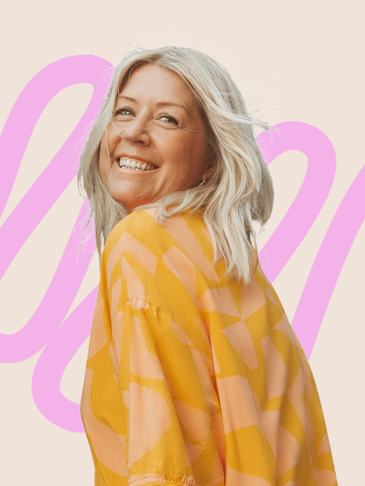 Sharon Hughes, founder of Good Marmalade, smiling over her shoulder in an orange patterned shirt